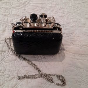 Crossbody black snakeskin print with skulls. Super cute!!